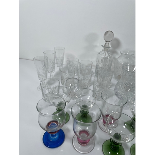 301 - A collection of Glassware including Decanter, jugs and coloured glasses.