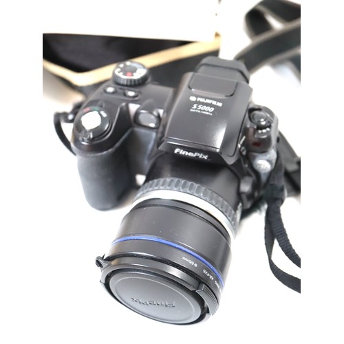 38 - A group of digital cameras including Canon Powershot s110, Fujifilm S5000, Canon Powershot S70, Cano... 