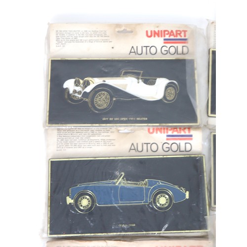 3 - A vintage group of eight Uni-Part Auto Gold Plaques