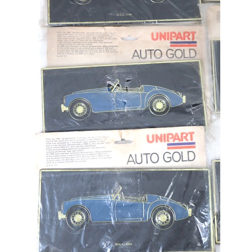 3 - A vintage group of eight Uni-Part Auto Gold Plaques