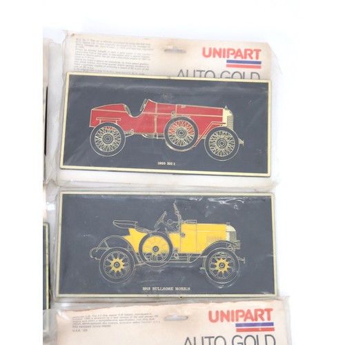 3 - A vintage group of eight Uni-Part Auto Gold Plaques