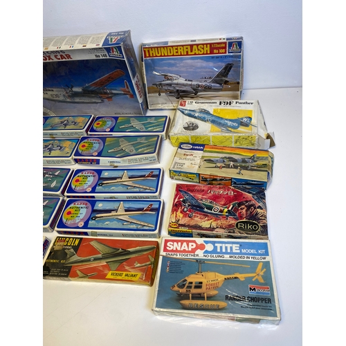 318 - A collection of Model plane kits including Italeri Fairchild Packet C119G Flying Box Car 146, Mitche... 