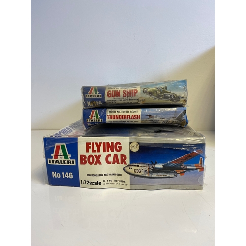 318 - A collection of Model plane kits including Italeri Fairchild Packet C119G Flying Box Car 146, Mitche... 