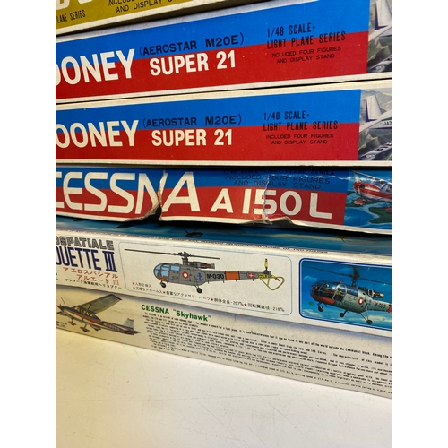 319 - A collection of Various Model plane assembly kits including LindBerg B-1 Bomber, Harrier, P-47B Thun... 