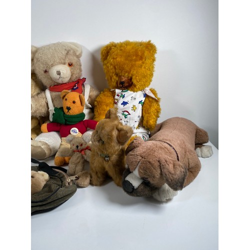 348 - A collection of Miscellaneous teddy bears including Harrods bag.