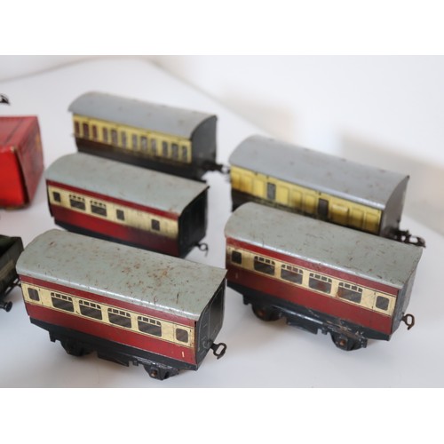 269 - A group of Hornby Tin plate Clock work locomotives , rolling stock, carriages, boxed straight rails,... 