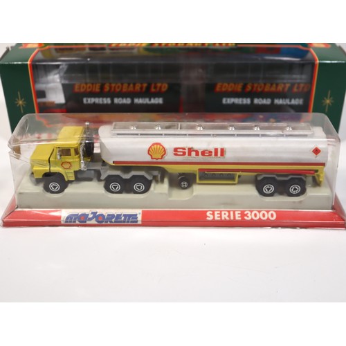 396 - A group of boxed die cast replicas including Majorette Serie 3000 Shell tanker, Corgi Eddie Stobart ... 