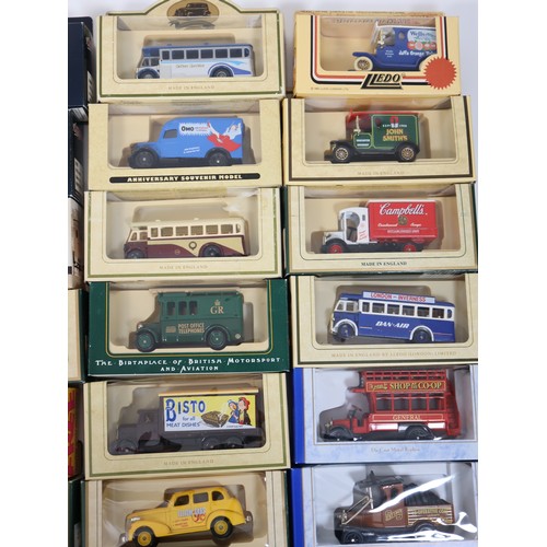 398 - A quantity of Lledo scale die-cast commercial livery vans etc