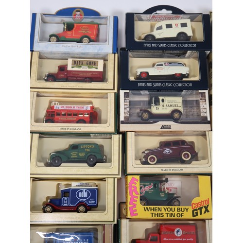 398 - A quantity of Lledo scale die-cast commercial livery vans etc