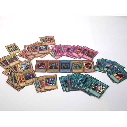 406 - A group of Yu-Gi-Oh Trading Cards from various sets including holo cards and 1st editions