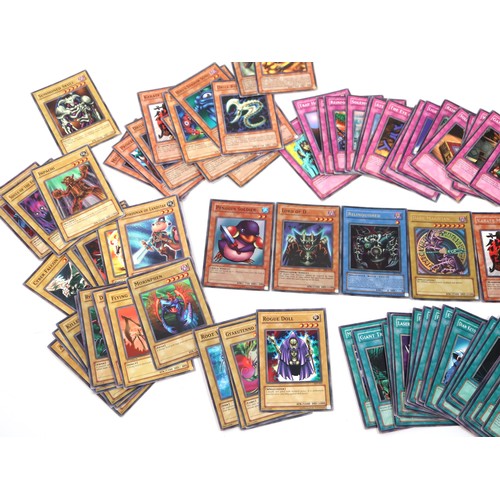 406 - A group of Yu-Gi-Oh Trading Cards from various sets including holo cards and 1st editions