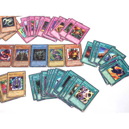 406 - A group of Yu-Gi-Oh Trading Cards from various sets including holo cards and 1st editions