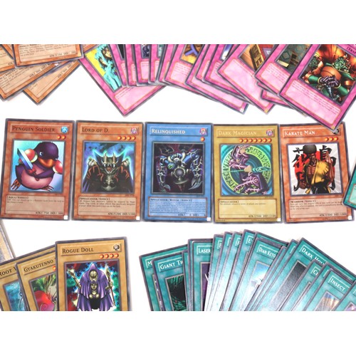 406 - A group of Yu-Gi-Oh Trading Cards from various sets including holo cards and 1st editions