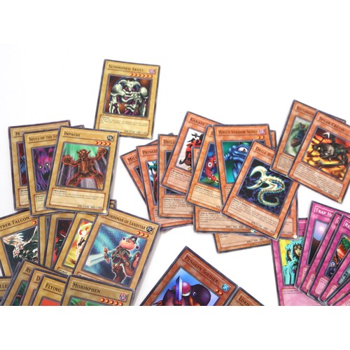 406 - A group of Yu-Gi-Oh Trading Cards from various sets including holo cards and 1st editions