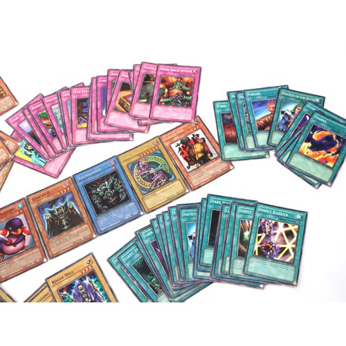 406 - A group of Yu-Gi-Oh Trading Cards from various sets including holo cards and 1st editions