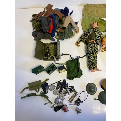 437 - Three Vintage Action Man with a bundle of various accessories including, Guns, Boots, clothes and Pa... 