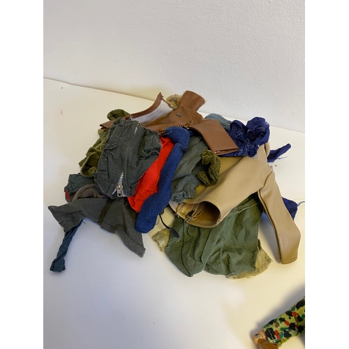 437 - Three Vintage Action Man with a bundle of various accessories including, Guns, Boots, clothes and Pa... 