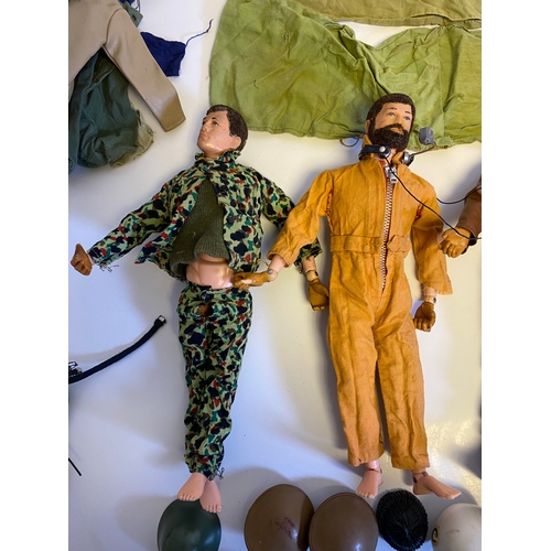 437 - Three Vintage Action Man with a bundle of various accessories including, Guns, Boots, clothes and Pa... 