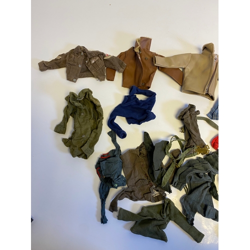 437 - Three Vintage Action Man with a bundle of various accessories including, Guns, Boots, clothes and Pa... 