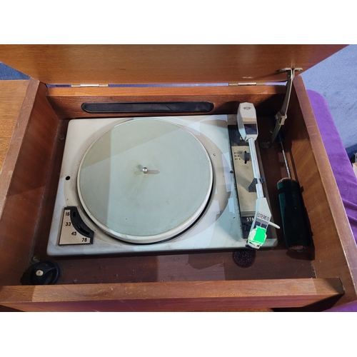 450A - Rigonda Symphony Radiogram with Turntable

Vintage Rigonda Symphony radiogram in a wooden cabinet, f... 