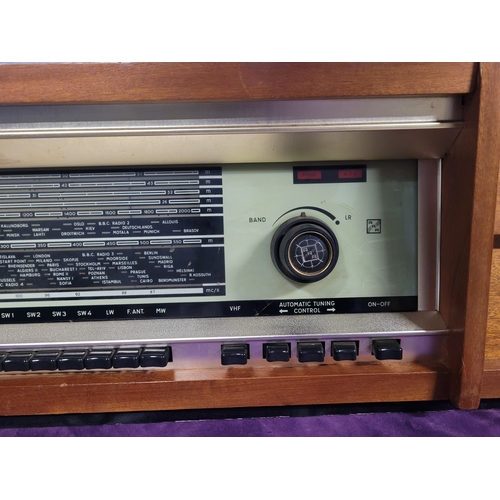 450A - Rigonda Symphony Radiogram with Turntable

Vintage Rigonda Symphony radiogram in a wooden cabinet, f... 