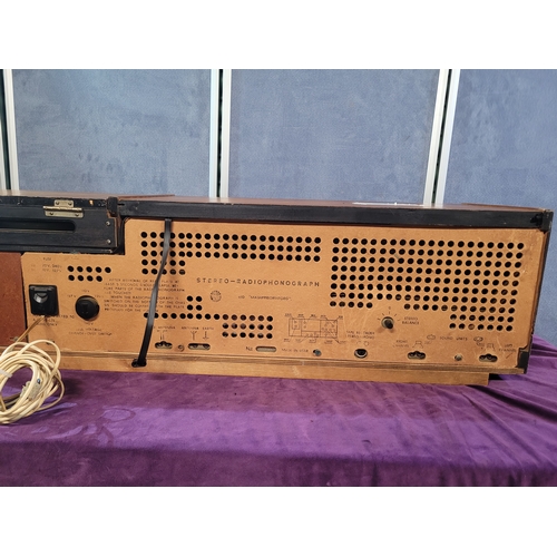 450A - Rigonda Symphony Radiogram with Turntable

Vintage Rigonda Symphony radiogram in a wooden cabinet, f... 