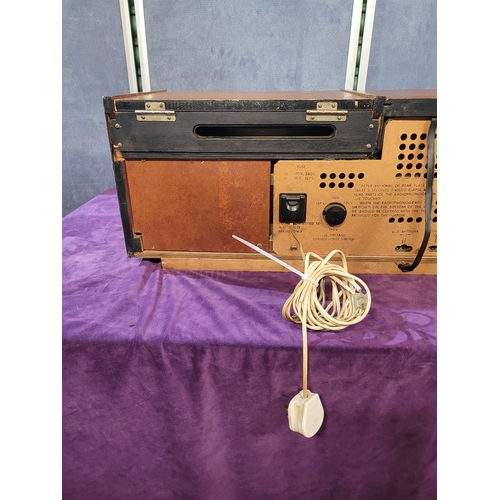 450A - Rigonda Symphony Radiogram with Turntable

Vintage Rigonda Symphony radiogram in a wooden cabinet, f... 