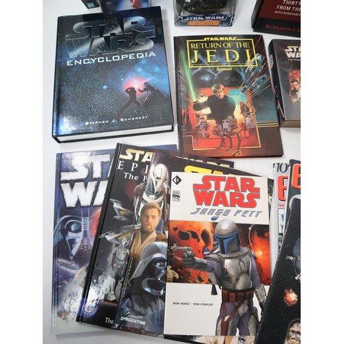 224 - A collection of various Star Wars collectables and books including The Star Wars Vault Hardback, 198... 