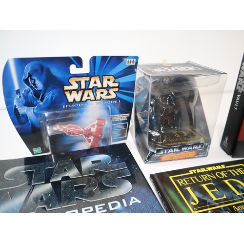 224 - A collection of various Star Wars collectables and books including The Star Wars Vault Hardback, 198... 