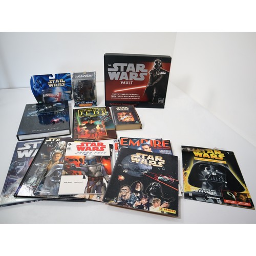 224 - A collection of various Star Wars collectables and books including The Star Wars Vault Hardback, 198... 