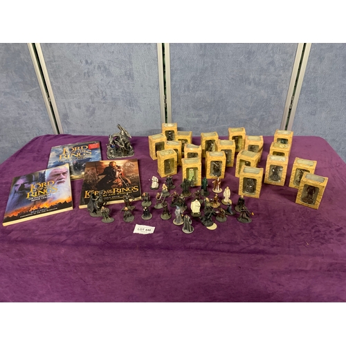 446 - A selection of Lord of the rings collectables including miniature figurines and books