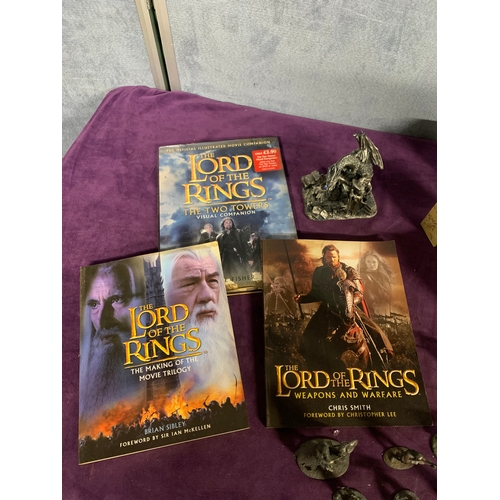 446 - A selection of Lord of the rings collectables including miniature figurines and books