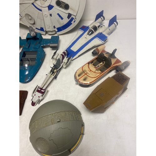 184 - A Collection of Various Star Wars Vehicles including,   Millennium Falcon, Speeder Bikes, Jawa Sandc... 