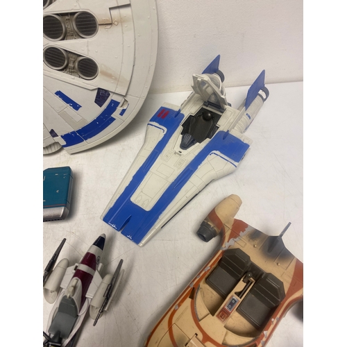 184 - A Collection of Various Star Wars Vehicles including,   Millennium Falcon, Speeder Bikes, Jawa Sandc... 