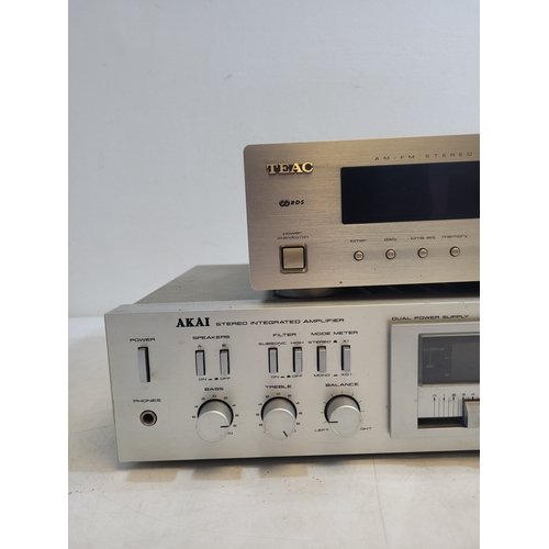 304 - Teac AM/FM stereo Tuner T-H500 and Akai stereo integrated amplifier AM-UO2