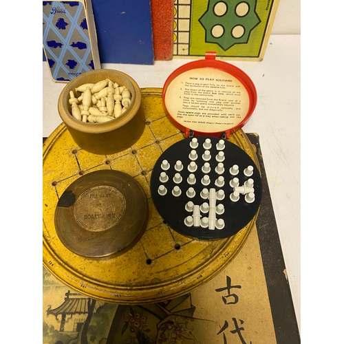 225 - A collection of Tabletop games including Go, Taxi, Pirate and Traveler, Quadwrangle, Halma, Draughts... 