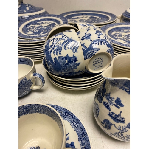228 - Large collection of Wedgwood -The Blue Willow story with and assortment of Plates, saucers cups, jug... 