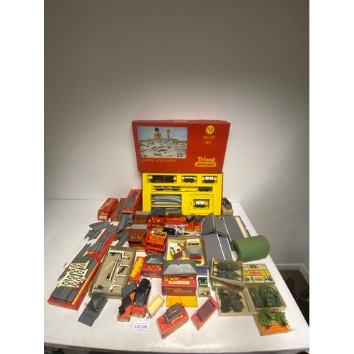 229 - Large collection of boxed Tri-ang Railways including RB Train Set, tracks, terrain, building and car... 