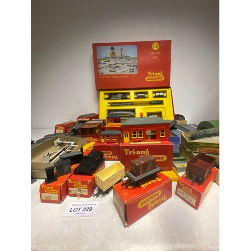 229 - Large collection of boxed Tri-ang Railways including RB Train Set, tracks, terrain, building and car... 