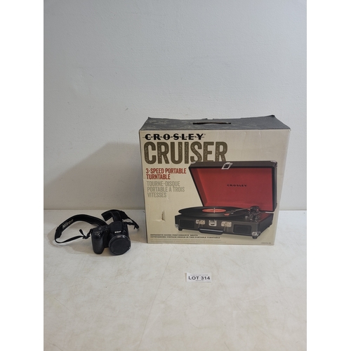 314 - New in box Crosley cruiser 3 speed portable turntable and a Nikon Coolpix L310  camera