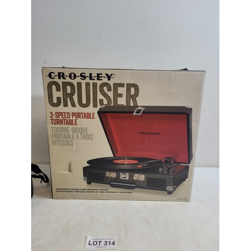 314 - New in box Crosley cruiser 3 speed portable turntable and a Nikon Coolpix L310  camera