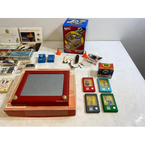 283 - Collection of toys, tea cards, and more