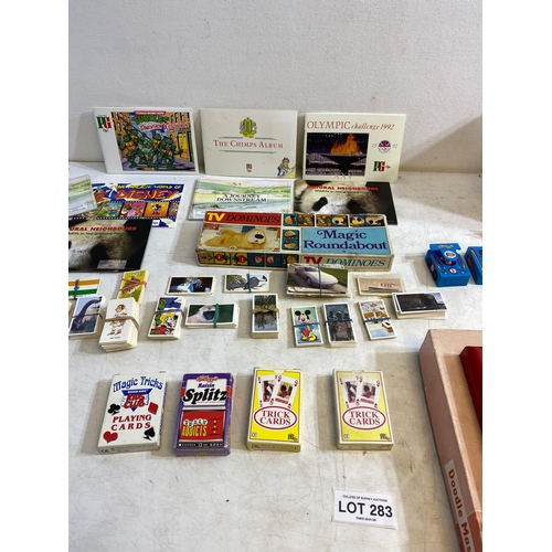 283 - Collection of toys, tea cards, and more