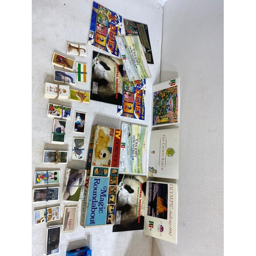 283 - Collection of toys, tea cards, and more