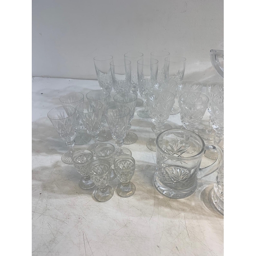 234 - Collection of finely cut crystal including jugs, bowls, tumblers, vases and more