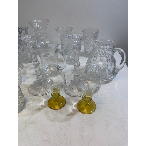 234 - Collection of finely cut crystal including jugs, bowls, tumblers, vases and more
