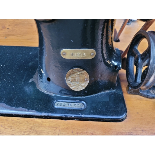 674 - Vintage singer 31K15 sewing machine on treadle