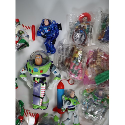 136 - Toy Story - A collection of Buzz Lightyear Action Figures in various sizes + sealed McDonalds toys v... 