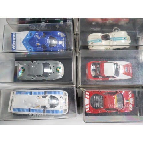 144 - A collection of cases 1:43 scale die cast model racers includes LeMans, Touring and domestic Porsche... 