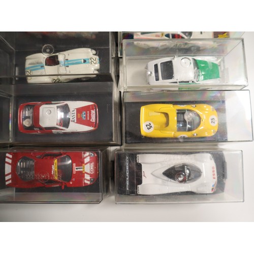 144 - A collection of cases 1:43 scale die cast model racers includes LeMans, Touring and domestic Porsche... 